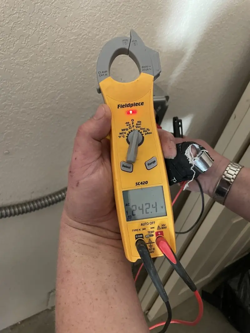 Voltage testing with clamp meter during Electrical Installation Services in Norwood